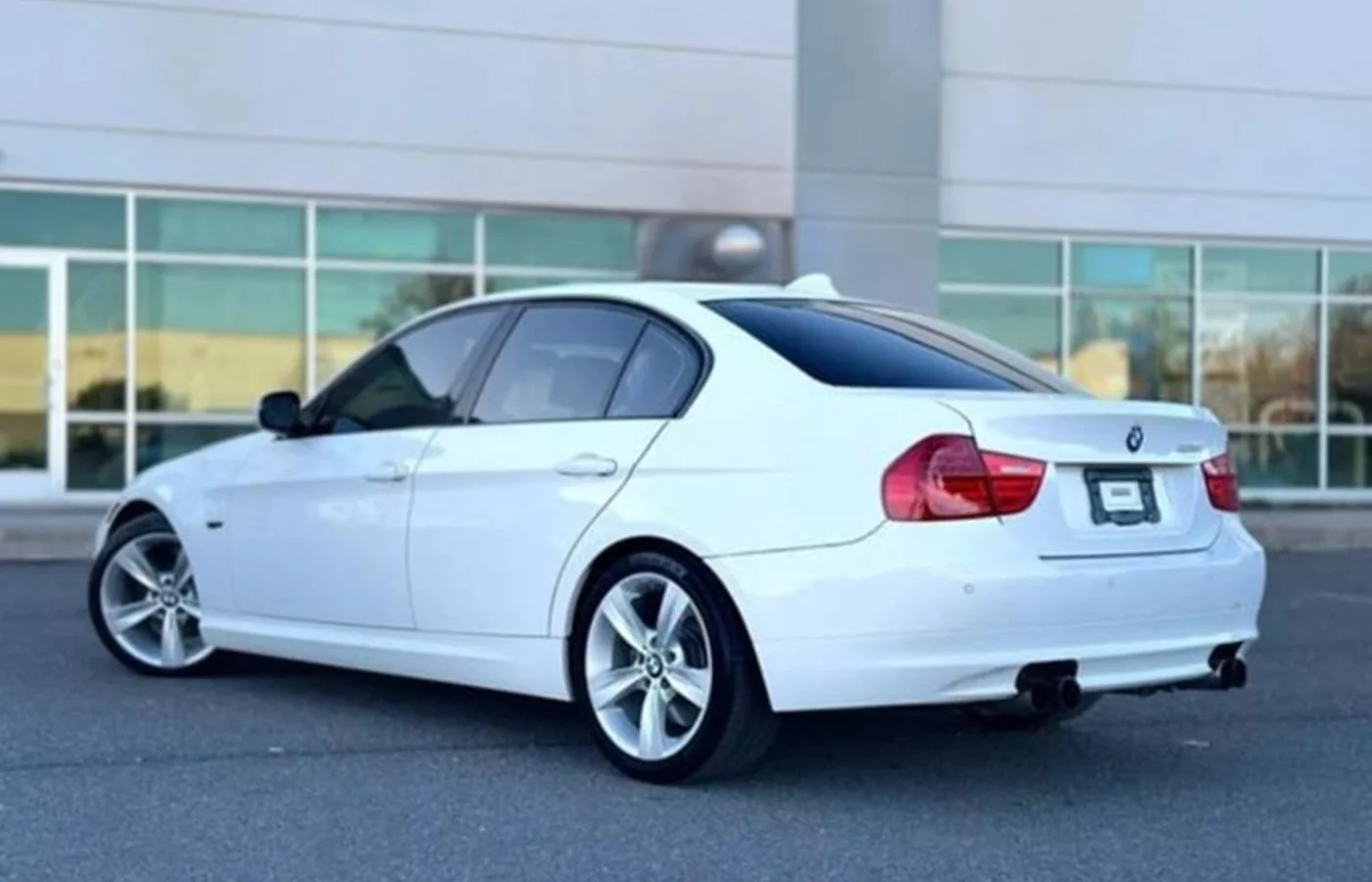 White BMW photographed outdoors after automotive work